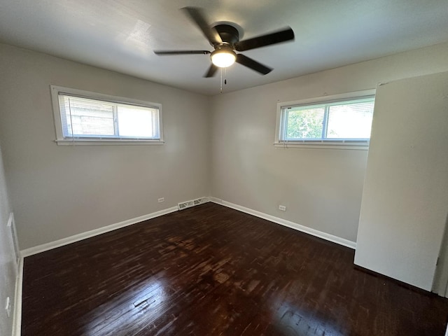 14631 Michigan Ave, Dolton, IL 60419 - spare room featuring wood finished floors, healthy amount of natural light, a ceiling fan, and baseboards