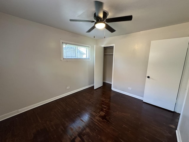 14631 Michigan Ave, Dolton, IL 60419 - unfurnished bedroom with wood finished floors, baseboards, a closet, and a ceiling fan