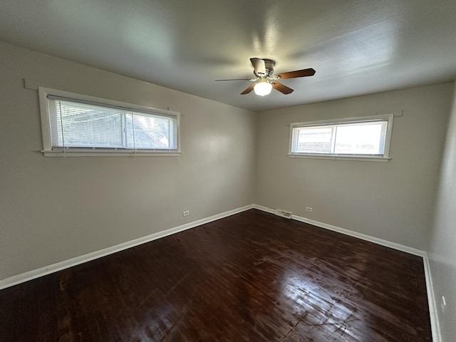 14631 Michigan Ave, Dolton, IL 60419 - spare room with a ceiling fan, baseboards, and dark wood-style floors