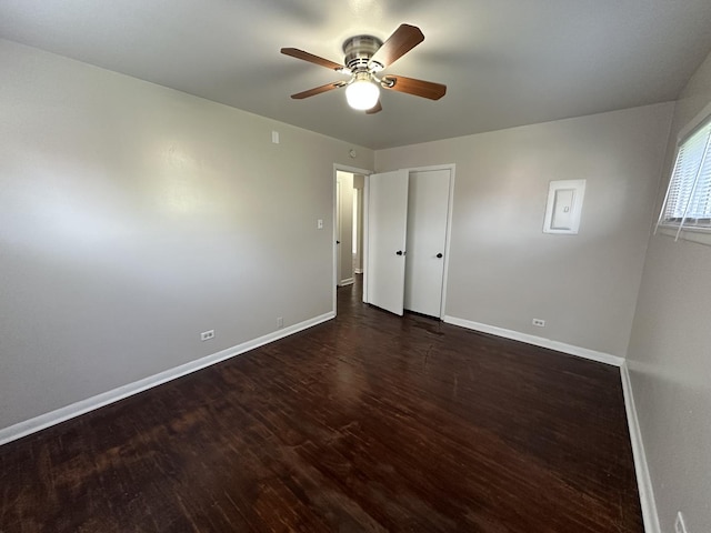 14631 Michigan Ave, Dolton, IL 60419 - unfurnished bedroom with baseboards, wood finished floors, and ceiling fan