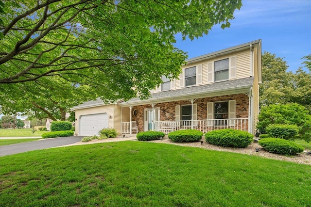 10 S Canterbury Rd, Aurora, IL 60506 - traditional-style home with a porch, asphalt driveway, a front lawn, and a garage