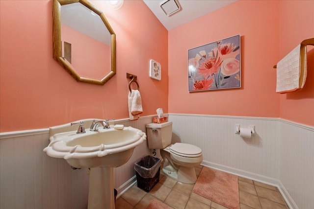 10 S Canterbury Rd, Aurora, IL 60506 - half bath featuring a wainscoted wall, toilet, and tile patterned flooring