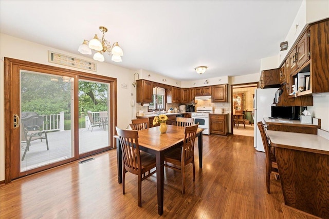 10 S Canterbury Rd, Aurora, IL 60506 - dining room with a chandelier and dark wood-style floors