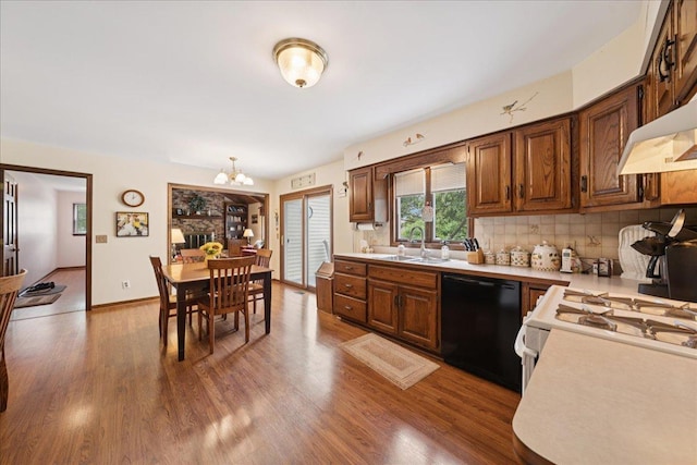 10 S Canterbury Rd, Aurora, IL 60506 - kitchen featuring black dishwasher, light countertops, a sink, a chandelier, and tasteful backsplash
