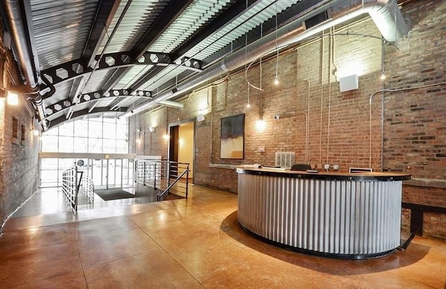 500 S Clinton St Unit 604, Chicago, IL 60607 - welcome area featuring brick wall, high vaulted ceiling, and beamed ceiling