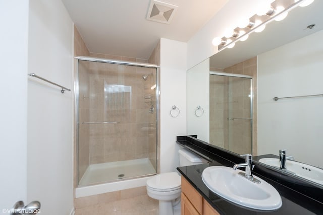 500 S Clinton St Unit 604, Chicago, IL 60607 - bathroom with a shower stall, vanity, toilet, and tile patterned floors