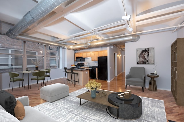 500 S Clinton St Unit 604, Chicago, IL 60607 - living area with light wood-style floors and baseboards