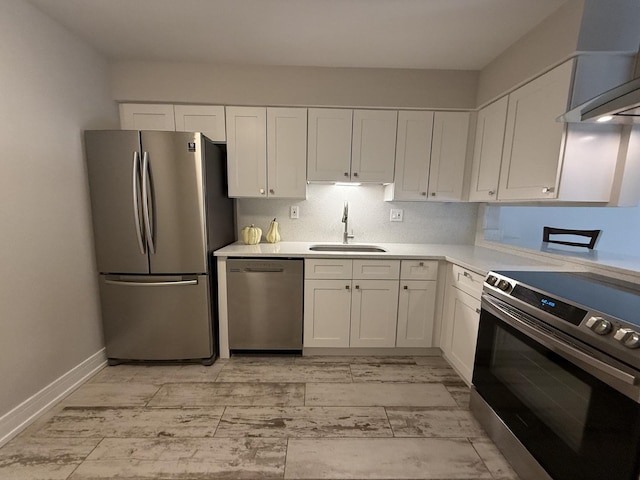 4508 Beau Monde Dr Unit 5, Lisle, IL 60532 - kitchen with stainless steel appliances, wall chimney exhaust hood, white cabinetry, and light countertops