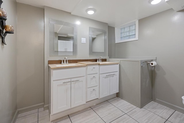 314 Catalpa Ave, Itasca, IL 60143 - bathroom with double vanity, tile patterned floors, baseboards, and toilet