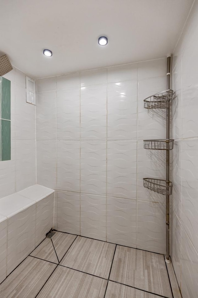 314 Catalpa Ave, Itasca, IL 60143 - bathroom with tiled shower, tile walls, and tile patterned floors