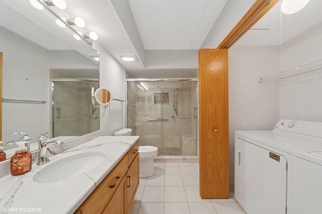 650 S River Rd Unit 405, Des Plaines, IL 60016 - full bathroom featuring washer and dryer, toilet, vanity, and a shower stall