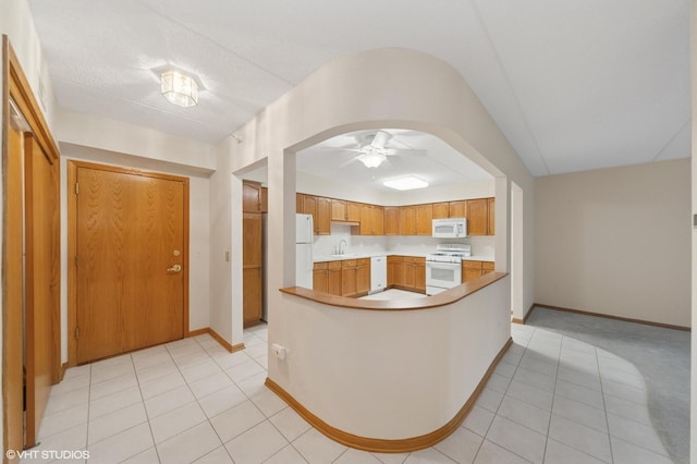 650 S River Rd Unit 405, Des Plaines, IL 60016 - kitchen with white appliances, a sink, light countertops, ceiling fan, and light tile patterned flooring