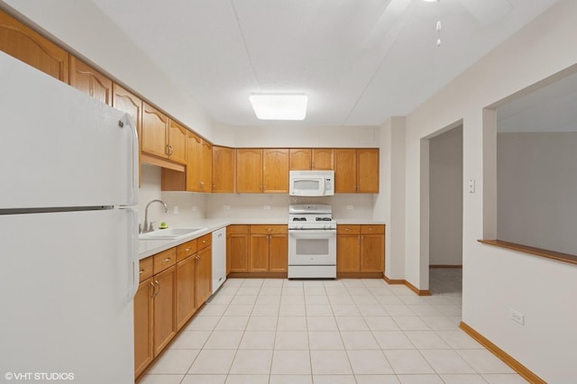 650 S River Rd Unit 405, Des Plaines, IL 60016 - kitchen featuring white appliances, a sink, light countertops, ceiling fan, and baseboards