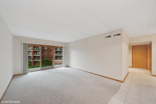 650 S River Rd Unit 405, Des Plaines, IL 60016 - unfurnished room featuring baseboards, light colored carpet, and light tile patterned floors