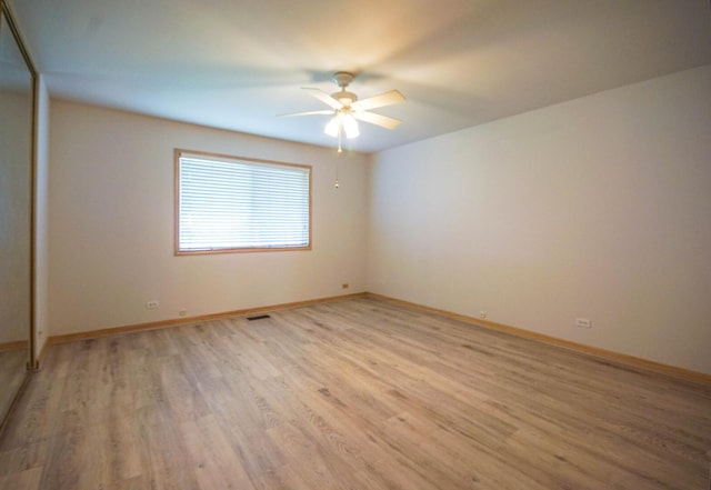 468 Independence Ln, Bolingbrook, IL 60440 - spare room featuring light wood-style floors, ceiling fan, and baseboards