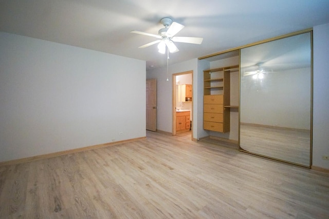 468 Independence Ln, Bolingbrook, IL 60440 - unfurnished bedroom with light wood-style floors, a closet, baseboards, and connected bathroom