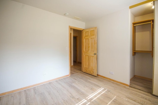 468 Independence Ln, Bolingbrook, IL 60440 - unfurnished bedroom featuring a closet, light wood-style flooring, and baseboards