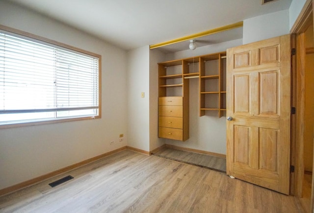 468 Independence Ln, Bolingbrook, IL 60440 - unfurnished bedroom featuring light wood-style flooring, a closet, and baseboards