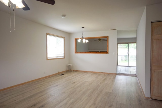 468 Independence Ln, Bolingbrook, IL 60440 - unfurnished room featuring a ceiling fan, light wood finished floors, baseboards, a chandelier, and a smoke detector