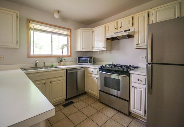 468 Independence Ln, Bolingbrook, IL 60440 - kitchen with stainless steel appliances, under cabinet range hood, a sink, and light countertops