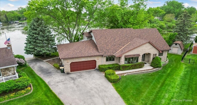 25827 W Andrew Ct, Ingleside, IL 60041 - view of front of house featuring roof with shingles, asphalt driveway, an attached garage, and stone siding