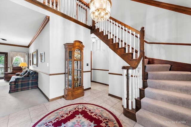 25827 W Andrew Ct, Ingleside, IL 60041 - tiled foyer entrance featuring stairway, baseboards, ornamental molding, a chandelier, and carpet floors