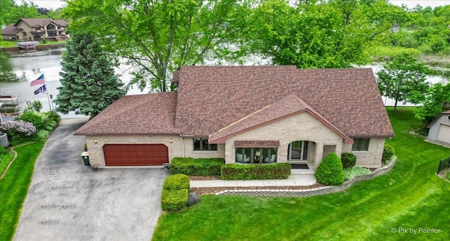 25827 W Andrew Ct, Ingleside, IL 60041 - view of front of property with a shingled roof, asphalt driveway, an attached garage, and a front yard