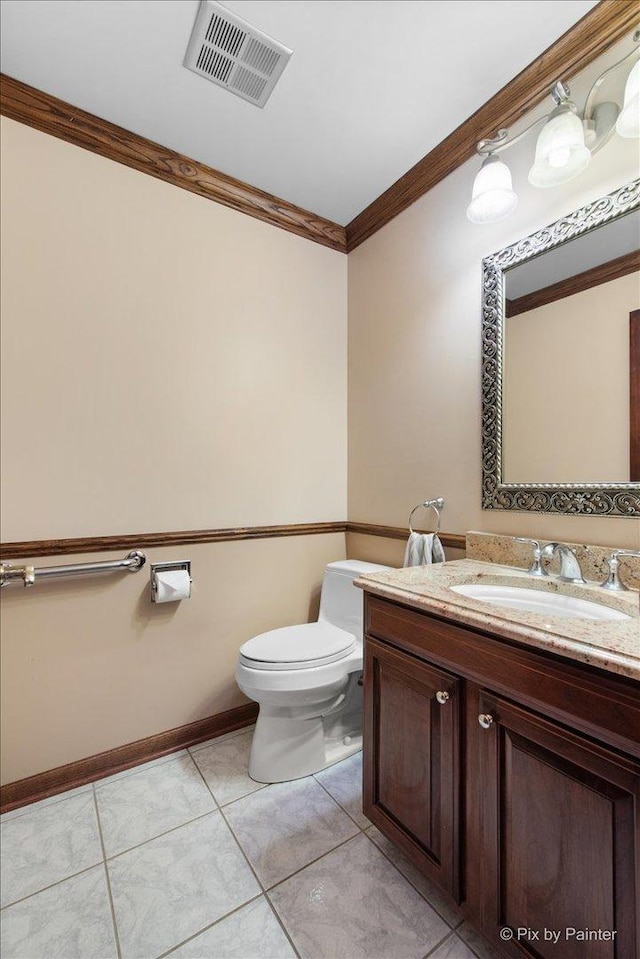 25827 W Andrew Ct, Ingleside, IL 60041 - bathroom featuring crown molding, toilet, vanity, tile patterned floors, and baseboards