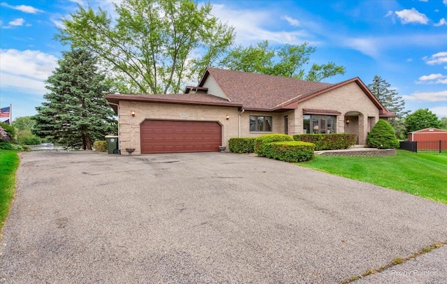 25827 W Andrew Ct, Ingleside, IL 60041 - view of front facade featuring an attached garage, asphalt driveway, brick siding, and roof with shingles