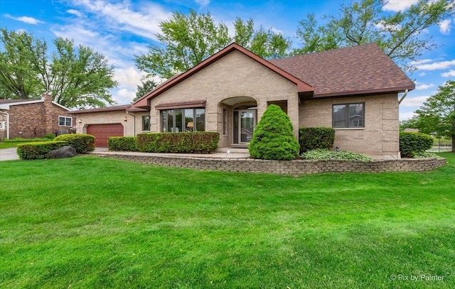 25827 W Andrew Ct, Ingleside, IL 60041 - view of front facade featuring an attached garage, brick siding, and a front yard
