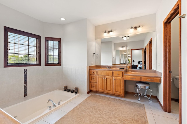 26644 S Ridgeland Ave, Monee, IL 60449 - full bathroom with tile patterned flooring, a tub with jets, vanity, and toilet