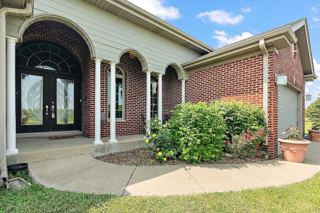 26644 S Ridgeland Ave, Monee, IL 60449 - entrance to property featuring french doors, brick siding, and a garage