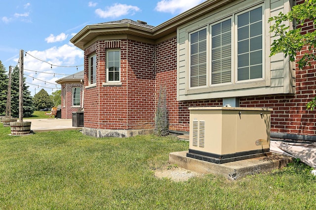 26644 S Ridgeland Ave, Monee, IL 60449 - view of home's exterior featuring brick siding and a yard