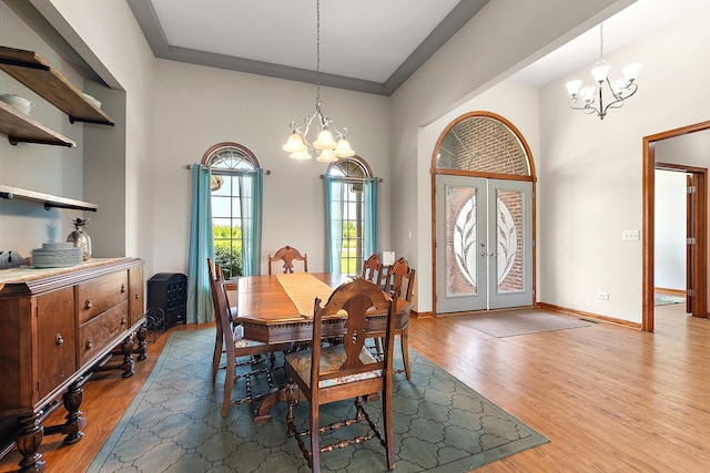 26644 S Ridgeland Ave, Monee, IL 60449 - dining space with a chandelier, wood finished floors, french doors, and baseboards