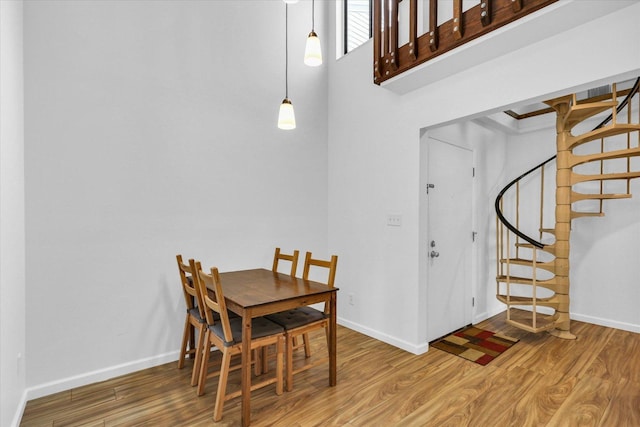 1910 Melrose Dr Unit C, Champaign, IL 61820 - dining space featuring wood finished floors, stairway, and baseboards