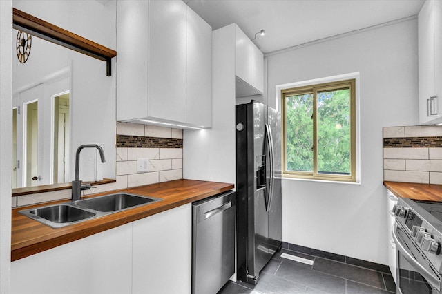 1910 Melrose Dr Unit C, Champaign, IL 61820 - kitchen with wood counters, appliances with stainless steel finishes, a sink, and white cabinets