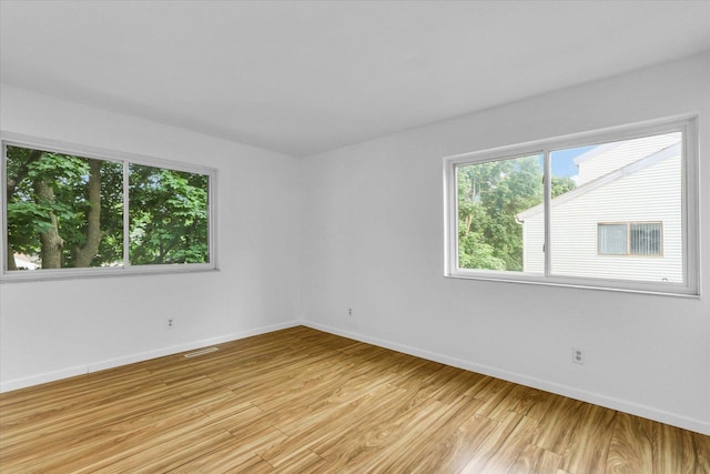 1910 Melrose Dr Unit C, Champaign, IL 61820 - unfurnished room with baseboards and light wood-type flooring