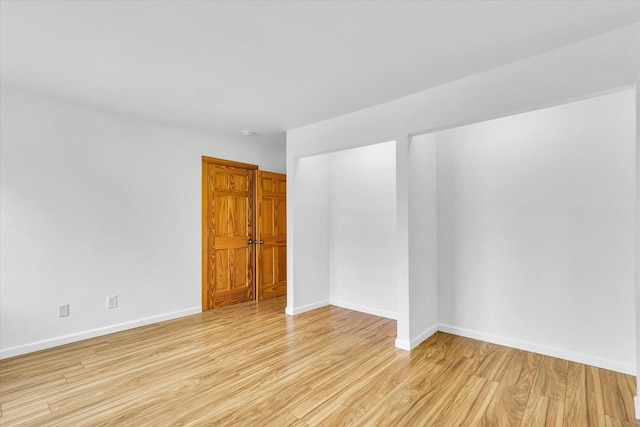 1910 Melrose Dr Unit C, Champaign, IL 61820 - empty room with light wood finished floors and baseboards