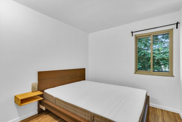 1910 Melrose Dr Unit C, Champaign, IL 61820 - bedroom with baseboards and wood finished floors