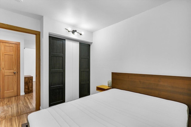 1910 Melrose Dr Unit C, Champaign, IL 61820 - bedroom with wood finished floors and a closet