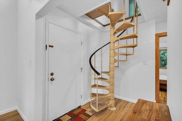 1910 Melrose Dr Unit C, Champaign, IL 61820 - foyer entrance featuring wood finished floors, baseboards, and stairway