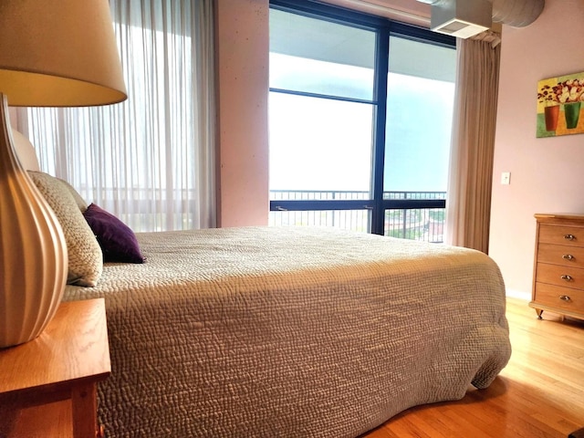 1530 S State St Unit 17R, Chicago, IL 60605 - bedroom featuring multiple windows and wood finished floors