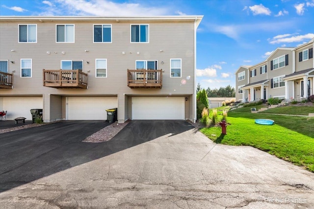 2346 Aurora Dr, Pingree Grove, IL 60140 - back of house featuring driveway, a garage, and a lawn
