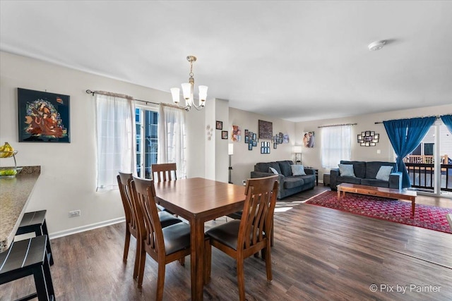2346 Aurora Dr, Pingree Grove, IL 60140 - dining space with a chandelier, wood finished floors, and baseboards