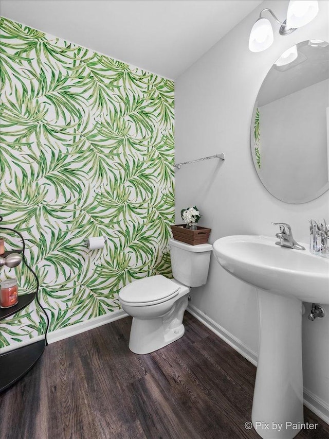 2346 Aurora Dr, Pingree Grove, IL 60140 - half bathroom featuring baseboards, toilet, wood finished floors, and a sink