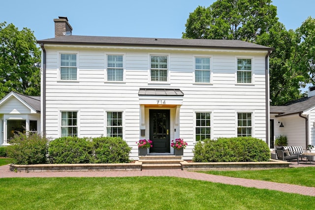 714 Turner Ave, Glen Ellyn, IL 60137 - colonial-style house featuring a chimney and a front yard