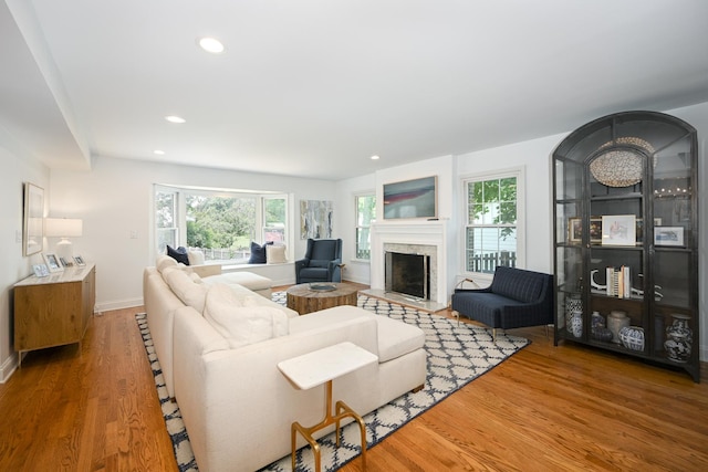 714 Turner Ave, Glen Ellyn, IL 60137 - living room with healthy amount of natural light, wood finished floors, a fireplace with raised hearth, and recessed lighting