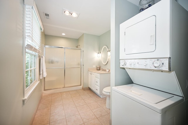 714 Turner Ave, Glen Ellyn, IL 60137 - laundry room featuring stacked washer / drying machine and light tile patterned floors