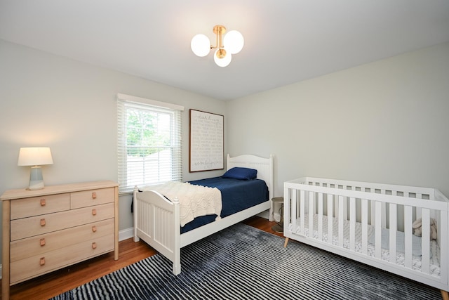 714 Turner Ave, Glen Ellyn, IL 60137 - bedroom featuring dark wood finished floors and a chandelier