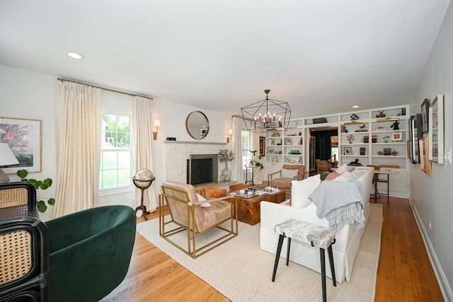 714 Turner Ave, Glen Ellyn, IL 60137 - living area featuring wood finished floors, a chandelier, a fireplace, and recessed lighting